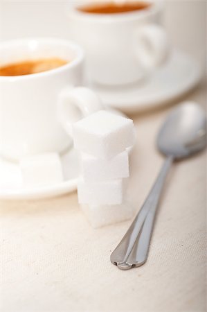 simsearch:400-05117073,k - Italian espresso coffee fresh brewed macro closeup with sugar cubes Foto de stock - Royalty-Free Super Valor e Assinatura, Número: 400-07088159