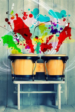 Photo of bongo drums with wooden background Stock Photo - Budget Royalty-Free & Subscription, Code: 400-07088490