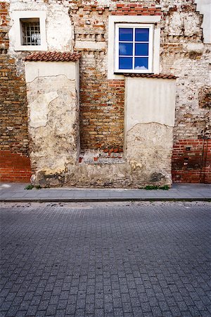 Aged weathered street wall with some windows Stock Photo - Budget Royalty-Free & Subscription, Code: 400-07088583