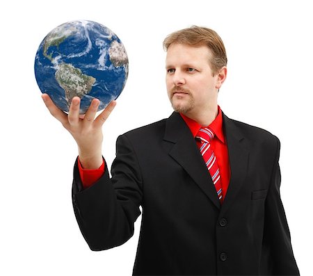 Powerful business man looking at Earth globe held in his hand Stock Photo - Budget Royalty-Free & Subscription, Code: 400-07088656