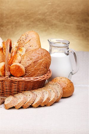 Assorted bread products with milk in jug on canvas Stock Photo - Budget Royalty-Free & Subscription, Code: 400-07088682