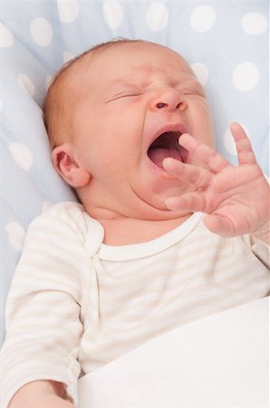 simsearch:400-07088353,k - Closeup of Face of Yawning Lying Newborn Baby Foto de stock - Royalty-Free Super Valor e Assinatura, Número: 400-07088764