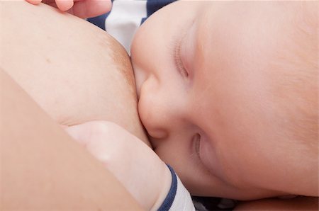 simsearch:400-05382792,k - Closeup of Mother Breast Feeding Her Baby Fotografie stock - Microstock e Abbonamento, Codice: 400-07088780