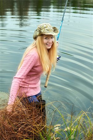 simsearch:400-06852239,k - beautiful blond girl fishing in pond at autumn Photographie de stock - Aubaine LD & Abonnement, Code: 400-07088928