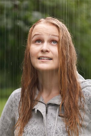 pouring rain on people - Young girl enjoys rain in the park. Close up portrait. Photographie de stock - Aubaine LD & Abonnement, Code: 400-07089325
