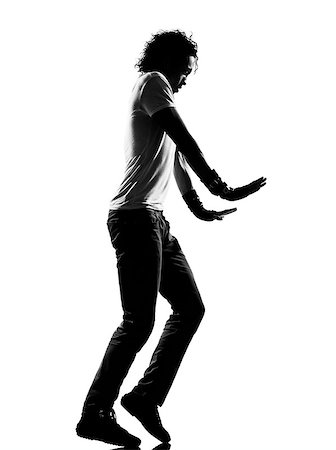 pas sur la lune - full length silhouette of a young man dancer moonwalk dancing funky hip hop r&b on  isolated  studio white background Photographie de stock - Aubaine LD & Abonnement, Code: 400-07089827