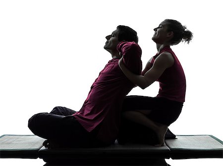 full body massage - one man and woman performing thai massage in silhouette studio on white background Foto de stock - Super Valor sin royalties y Suscripción, Código: 400-07089883