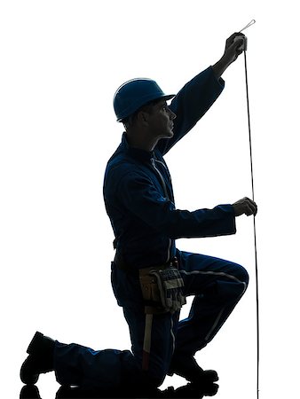 silhouette as carpenter - one caucasian man construction worker Tape Measure silhouette in studio on white background Foto de stock - Super Valor sin royalties y Suscripción, Código: 400-07089947