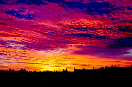 rick0304 (artist) - Beautiful colorful sunset over the silhouettes of the houses. Foto de stock - Super Valor sin royalties y Suscripción, Código: 400-07094194