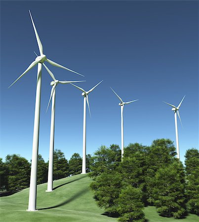 view of a grassy hill where are placed a row of white wind generators in the middle of some trees, and a clear blue sky on the background Fotografie stock - Microstock e Abbonamento, Codice: 400-07094558