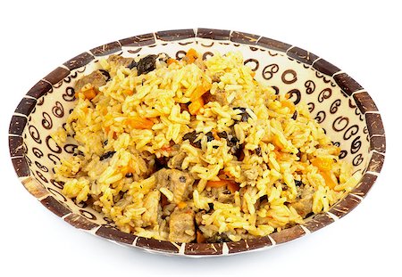 simsearch:630-02220568,k - Traditional Asian Pilau with Meat, Barberry and Carrot in Variegated Plate isolated on white background Stockbilder - Microstock & Abonnement, Bildnummer: 400-07094793