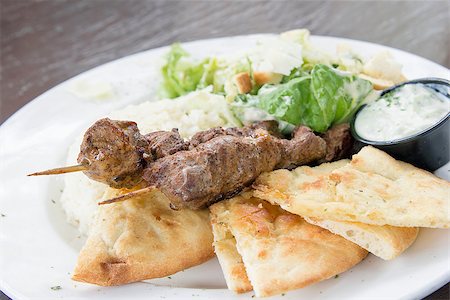 Lamb Kebab Skewers with Basmati Rice Naan Bread and Salad Closeup Stock Photo - Budget Royalty-Free & Subscription, Code: 400-07095333