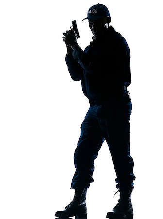 simsearch:400-07728896,k - Full length of an alert afro American policeman standing with handgun on white isolated background Stock Photo - Budget Royalty-Free & Subscription, Code: 400-07095426