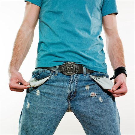 photographic portraits poor people - detail of a poor young man showing his empty pockets on studio isolated background Stock Photo - Budget Royalty-Free & Subscription, Code: 400-07095427