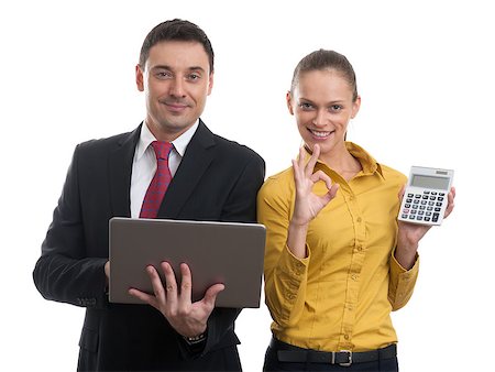 business couple with laptop and calculator Stock Photo - Budget Royalty-Free & Subscription, Code: 400-07096128