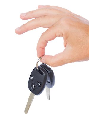 simsearch:400-04590086,k - hand holding a car keys isolated on white background Photographie de stock - Aubaine LD & Abonnement, Code: 400-07097023