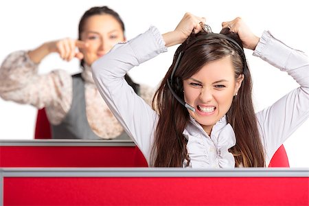 person screaming pulling hair - Angry frustrated call center female agent screaming and pulling her hair in rage with female colleague pointing at her from behind. Bad day at work. Stressful work environment. Stock Photo - Budget Royalty-Free & Subscription, Code: 400-07097135