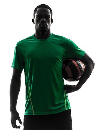 one african man soccer player green jersey holding football  in silhouette  on white background Stock Photo - Budget Royalty-Free & Subscription, Code: 400-07097582