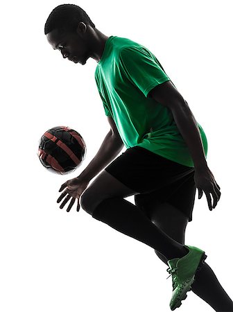 one african man soccer player green jersey juggling in silhouette  on white background Stock Photo - Budget Royalty-Free & Subscription, Code: 400-07097583