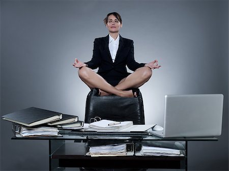 beautiful cheerful caucasian  business ecretary woman levitate from her desk on isolated background Stock Photo - Budget Royalty-Free & Subscription, Code: 400-07097651