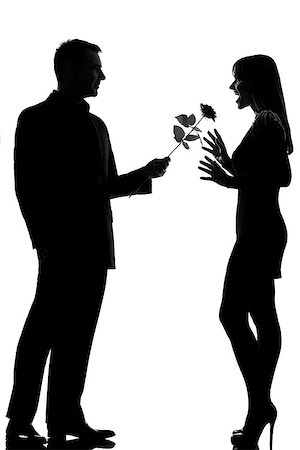 one caucasian lovers couple man offering rose flower and woman surprised in studio silhouette isolated on white background Photographie de stock - Aubaine LD & Abonnement, Code: 400-07097695