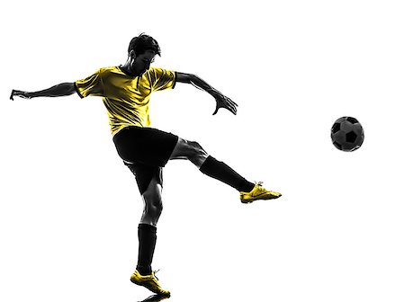 soccer player ball foot - one brazilian soccer football player young man kicking in silhouette studio  on white background Stock Photo - Budget Royalty-Free & Subscription, Code: 400-07097888