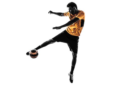 football man kicking white background - one caucasian young man soccer player orange jersey in silhouette  on white background Stock Photo - Budget Royalty-Free & Subscription, Code: 400-07097880