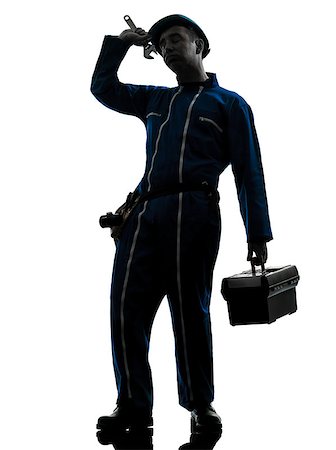 one caucasian repairman worker tired fatigue silhouette in studio on white background Stock Photo - Budget Royalty-Free & Subscription, Code: 400-07097980