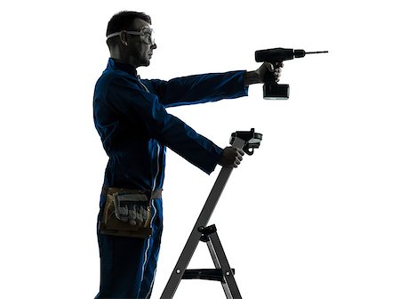 silhouette as carpenter - one caucasian man construction worker holding drill silhouette in studio on white background Stock Photo - Budget Royalty-Free & Subscription, Code: 400-07097981