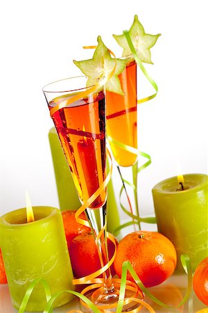 simsearch:400-06913390,k - Two orange alcohol cocktails with mandarines and light candles isolated on white background Stock Photo - Budget Royalty-Free & Subscription, Code: 400-07098174