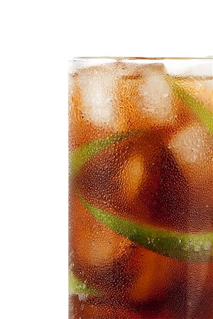 simsearch:400-06913325,k - Cuba libre alcohol cocktail isolated on white.  Ingredients: 1 oz  white on black rum, 2 oz cola, 1 fresh lime and ice Stockbilder - Microstock & Abonnement, Bildnummer: 400-07098284