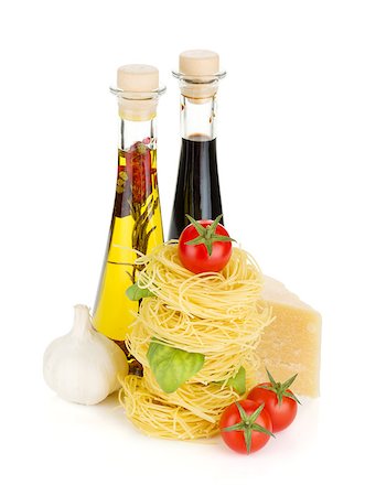 simsearch:400-06796271,k - Pasta, tomatoes, basil, olive oil, vinegar, garlic and parmesan cheese. Isolated on white background Stock Photo - Budget Royalty-Free & Subscription, Code: 400-07098592