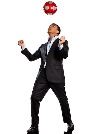 one caucasian business man playing juggling soccer ball in studio isolated on white background Foto de stock - Super Valor sin royalties y Suscripción, Código: 400-07098859