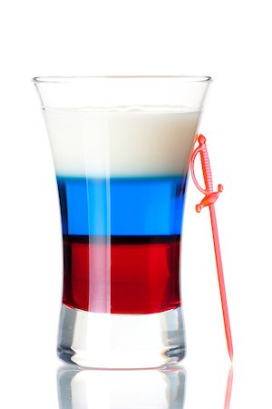 simsearch:400-06919155,k - Shot cocktail collection: Russian Flag alcohol cocktail isolated on white background. Ingredients: 1 oz Grenadine, 1 oz Blue Curacao, 0.5 oz Vodka, 0.5 oz Baileys Irish Cream Stock Photo - Budget Royalty-Free & Subscription, Code: 400-07099196