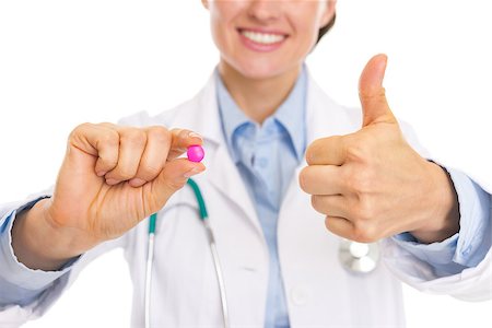 simsearch:400-07099832,k - Closeup on pill in hand of smiling doctor woman Stock Photo - Budget Royalty-Free & Subscription, Code: 400-07099829