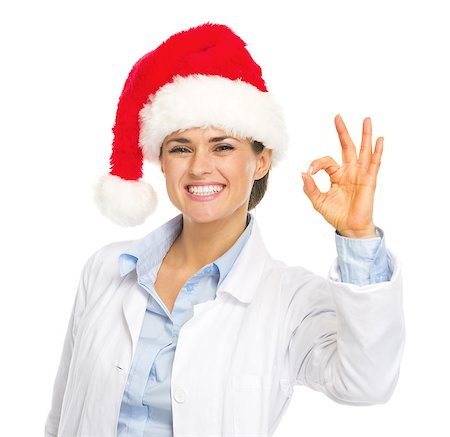 simsearch:400-07099823,k - Happy doctor woman in santa hat showing ok gesture Stock Photo - Budget Royalty-Free & Subscription, Code: 400-07099854