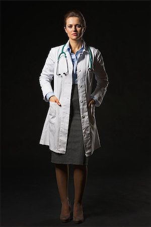 simsearch:400-07099823,k - Full length portrait of doctor woman isolated on black Stock Photo - Budget Royalty-Free & Subscription, Code: 400-07099871