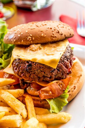 simsearch:400-05745151,k - Cheese burger - American cheese burger with fresh salad Stock Photo - Budget Royalty-Free & Subscription, Code: 400-07090185