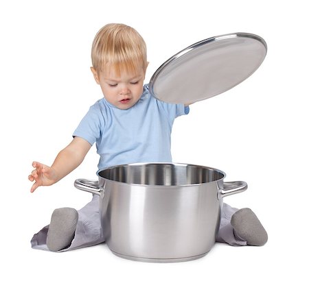 Baby looking inside saucepan. Isolated on white background Stock Photo - Budget Royalty-Free & Subscription, Code: 400-07090461