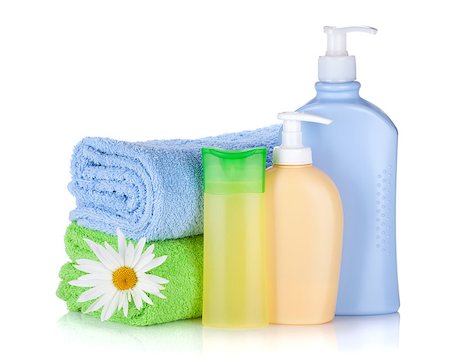 simsearch:400-04789848,k - Shampoo and gel bottles with towels and flower. Isolated on white background Stock Photo - Budget Royalty-Free & Subscription, Code: 400-07090482