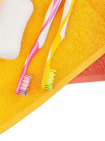 simsearch:400-08133885,k - Toothbrushes, soap and two towels. Isolated on white background Photographie de stock - Aubaine LD & Abonnement, Code: 400-07090538