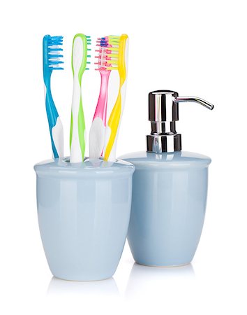 simsearch:400-04552289,k - Four colorful toothbrushes and liquid soap. Isolated on white background Foto de stock - Super Valor sin royalties y Suscripción, Código: 400-07090709