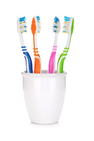 simsearch:400-04552289,k - Four colorful toothbrushes. Isolated on white background Foto de stock - Super Valor sin royalties y Suscripción, Código: 400-07090710