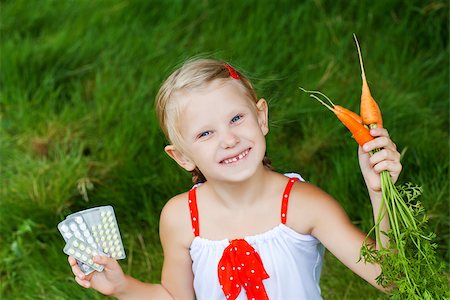 small girl with medicine and carrots Stock Photo - Budget Royalty-Free & Subscription, Code: 400-07090769