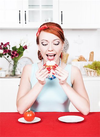 fat people eating at home - Beautiful woman eating cake on the kitchen Stock Photo - Budget Royalty-Free & Subscription, Code: 400-07090847
