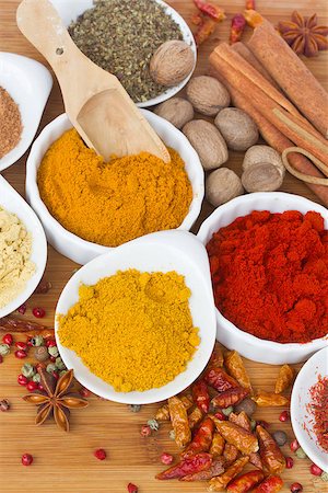 simsearch:400-06069438,k - colorful spices of curry, cucrma and red pepper with seeds of anise and nutmeg on wooden table Photographie de stock - Aubaine LD & Abonnement, Code: 400-07091538