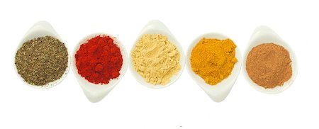 simsearch:400-06069438,k - row of plates with spices curry, pepper, nutmeg, ginger and oregano isolated on white Photographie de stock - Aubaine LD & Abonnement, Code: 400-07091539