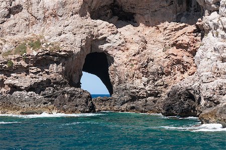 simsearch:400-05052257,k - Window cave in rock cliff just above sea level Stock Photo - Budget Royalty-Free & Subscription, Code: 400-07091792