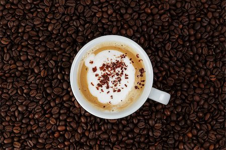 simsearch:400-07306295,k - cappucino in cup on coffee beans, coffee theme Foto de stock - Super Valor sin royalties y Suscripción, Código: 400-07091806