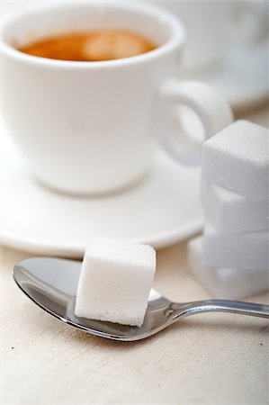 simsearch:400-04554624,k - Italian espresso coffee fresh brewed macro closeup with sugar cubes Stock Photo - Budget Royalty-Free & Subscription, Code: 400-07092693